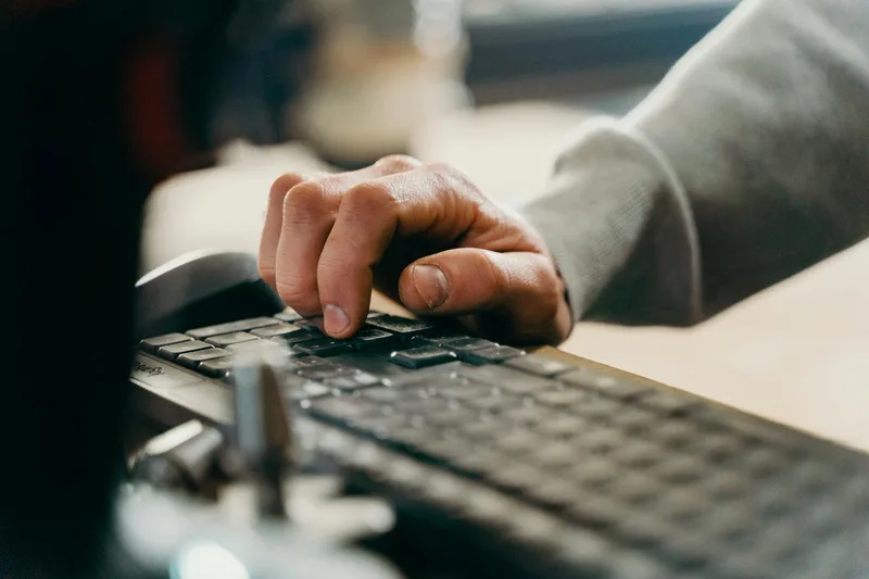 Image: Illustration showing manual data entry on one side (person at keyboard, multiple browser tabs) versus automated data flow on the other (connected systems with data moving between them)