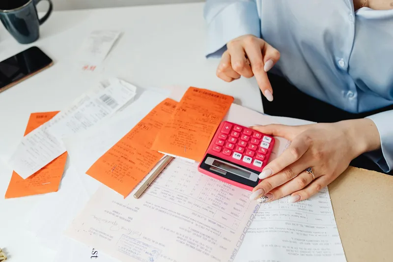Image: Calculator/worksheet template showing the manual process cost formula with example numbers filled in, designed to be screenshot-and-use